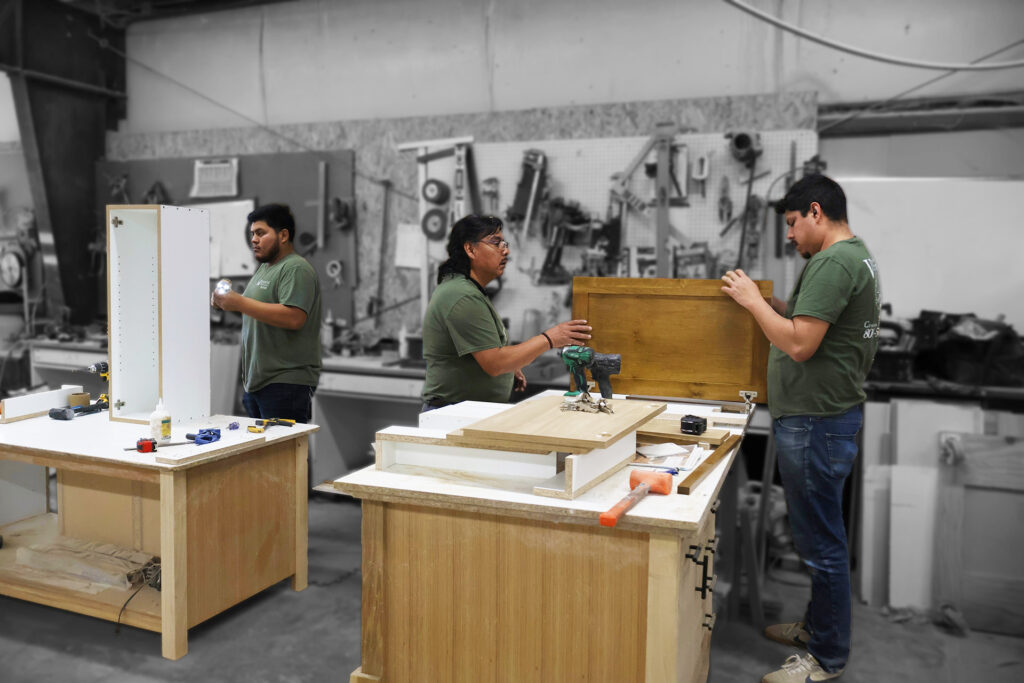 Vargas Custom Furnishing team working on custom cabinets