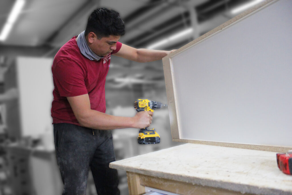 A carpenter building a cabinet