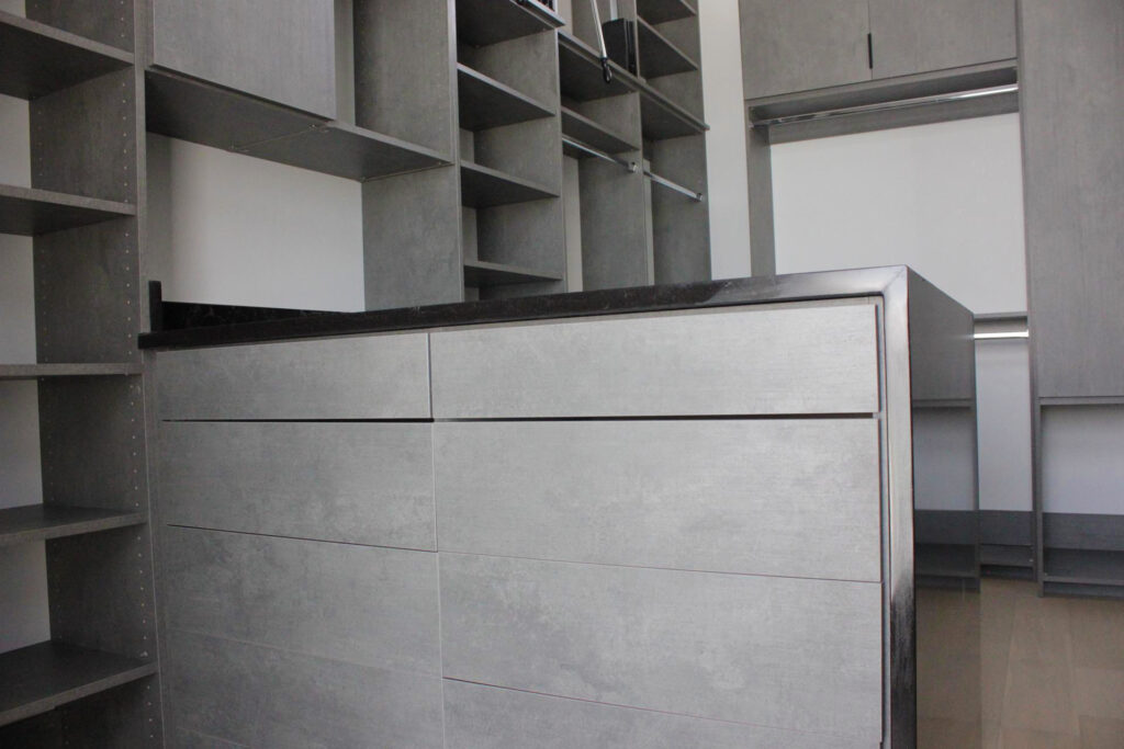 Custom cabinets covering a dresser room